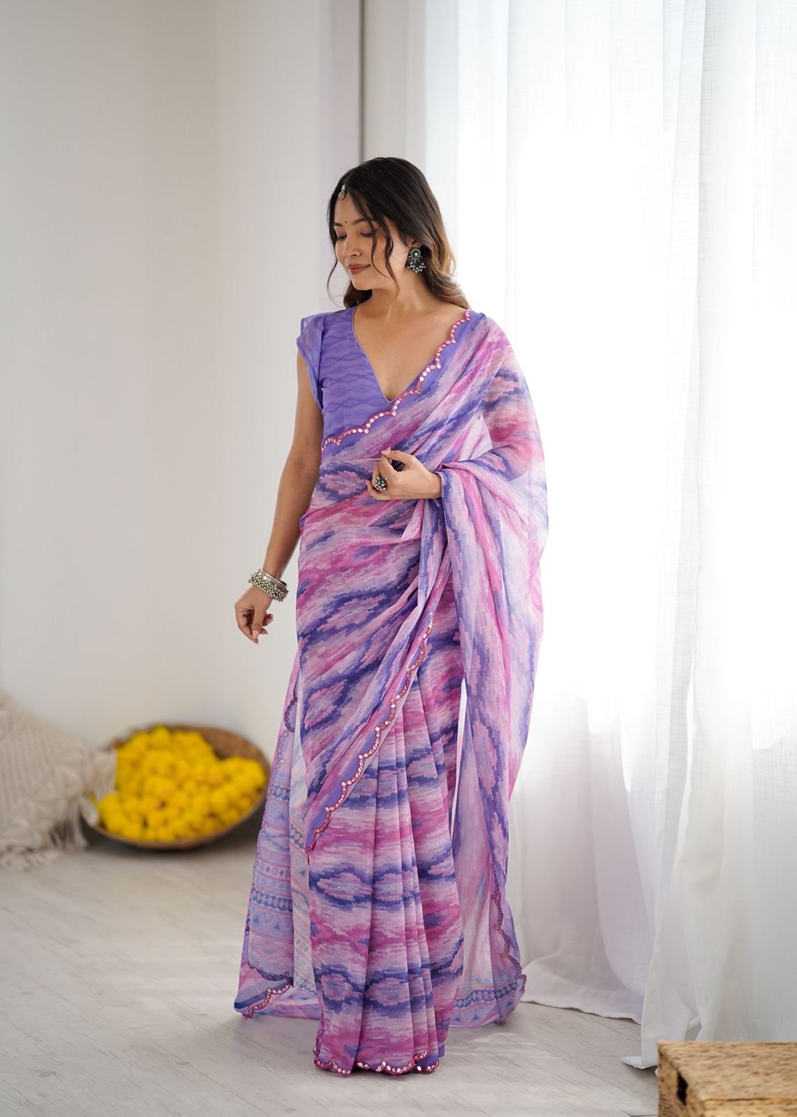 Heavy Georgette Printed Saree with Multi-Tone Mirror Work Border