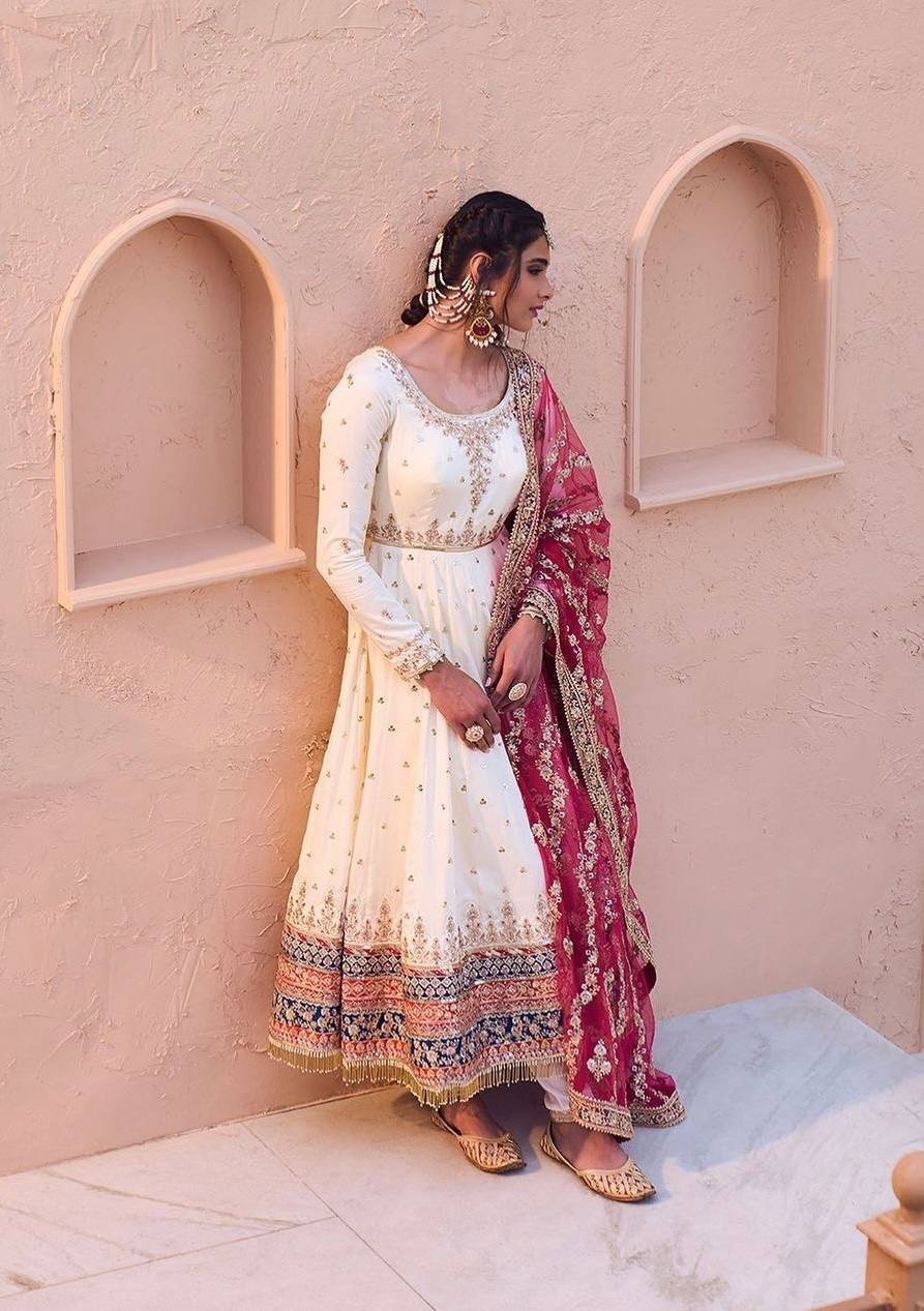 Ethereal Ivory Glow: Heavy Faux Georgette Anarkali Gown with Embroidered Tassels Code !! F.B.S.S.